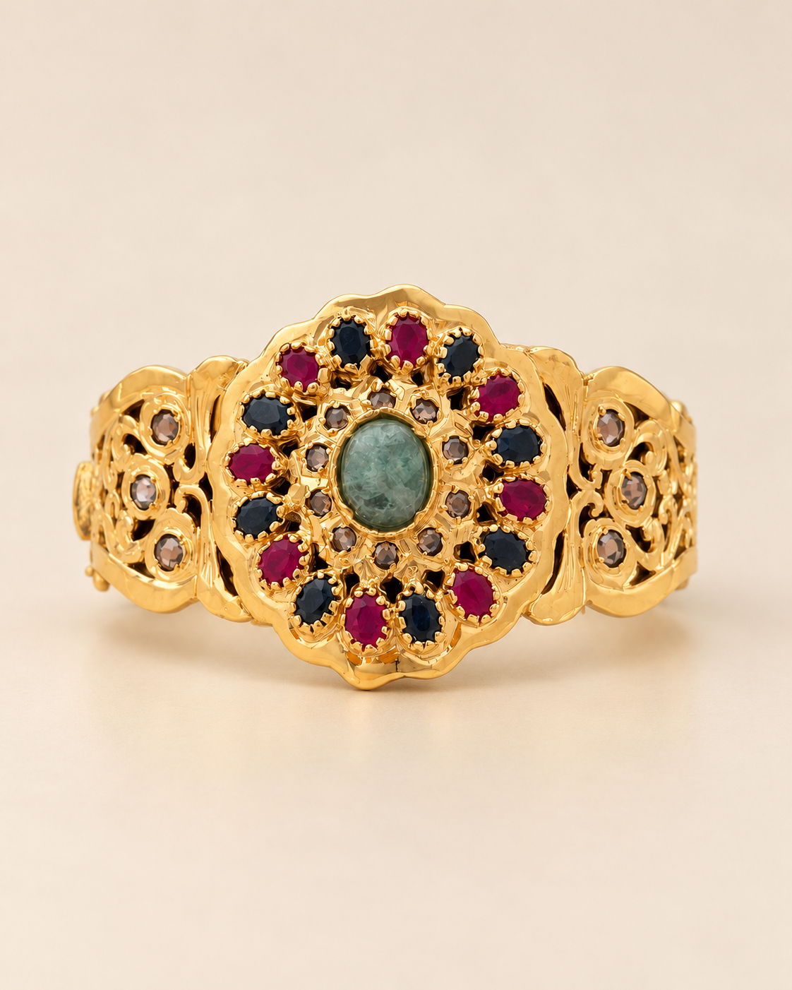 Moroccan 925 sterling silver bracelet with a multicolour floral medallion, shown alone on a warm ivory background.