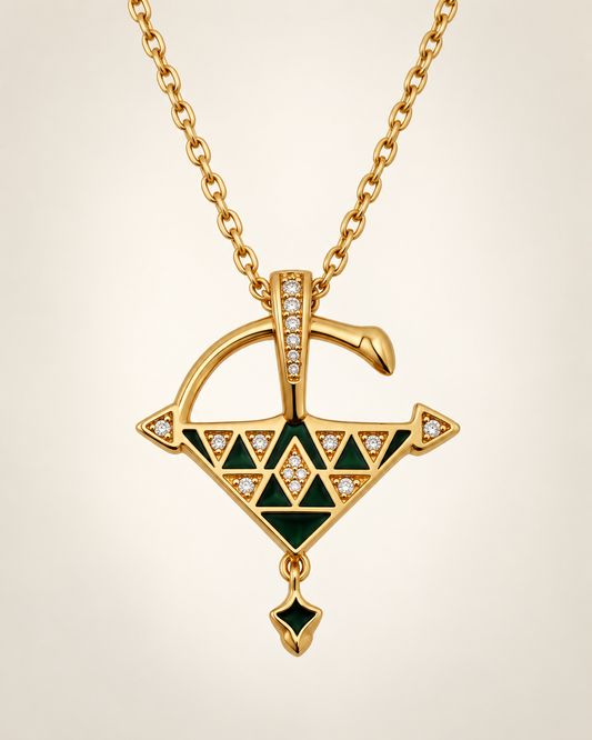 Gold vermeil Tizerzit necklace with green enamel pendant displayed against a soft neutral background 